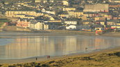 SX00648 People walking Tramore beach.jpg